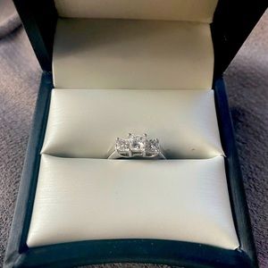 white gold engagement ring. 3 diamonds combined are one karat. Size 6 1/2.